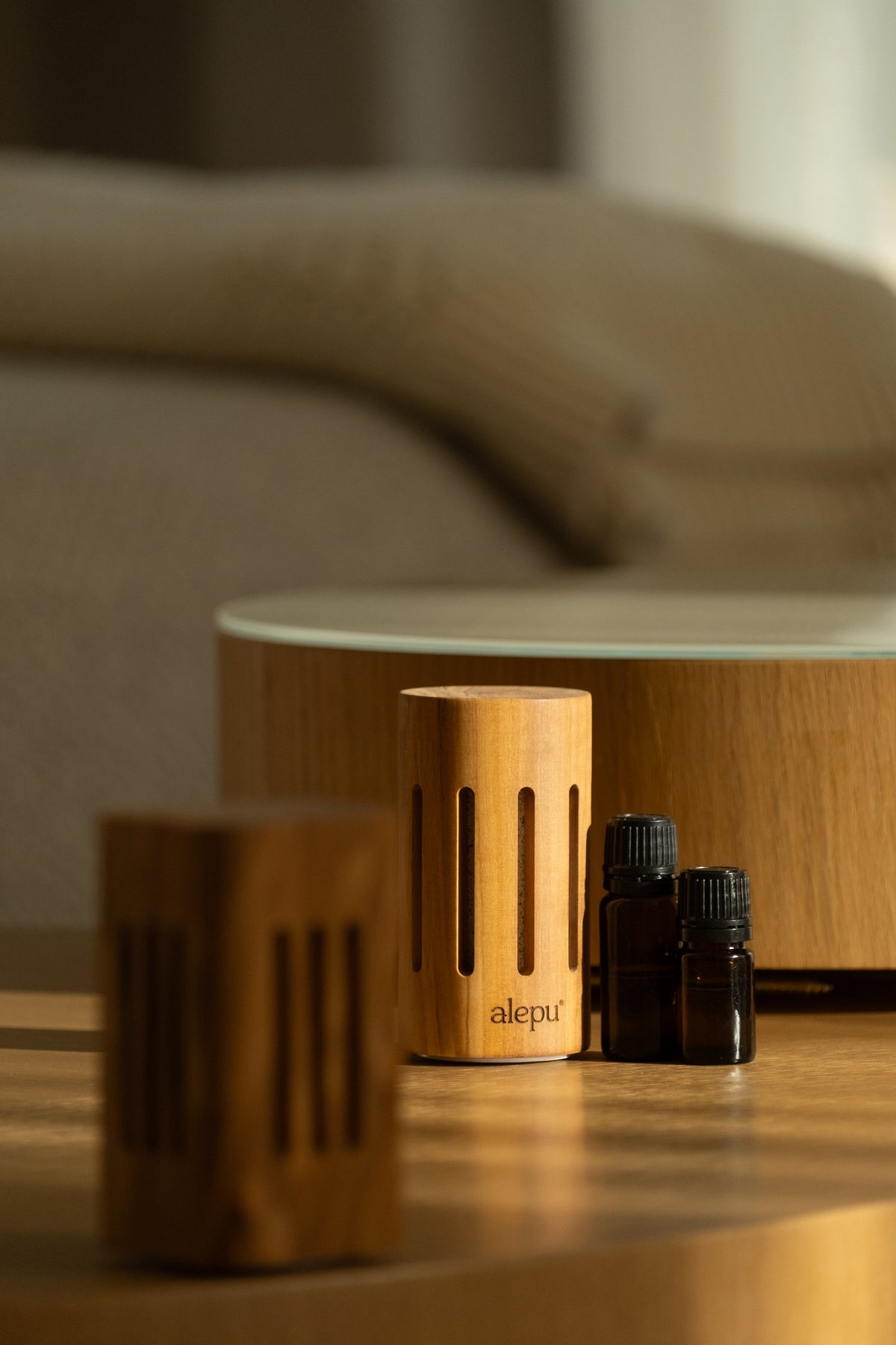 Square and round olive wood diffusers with two small oil bottles