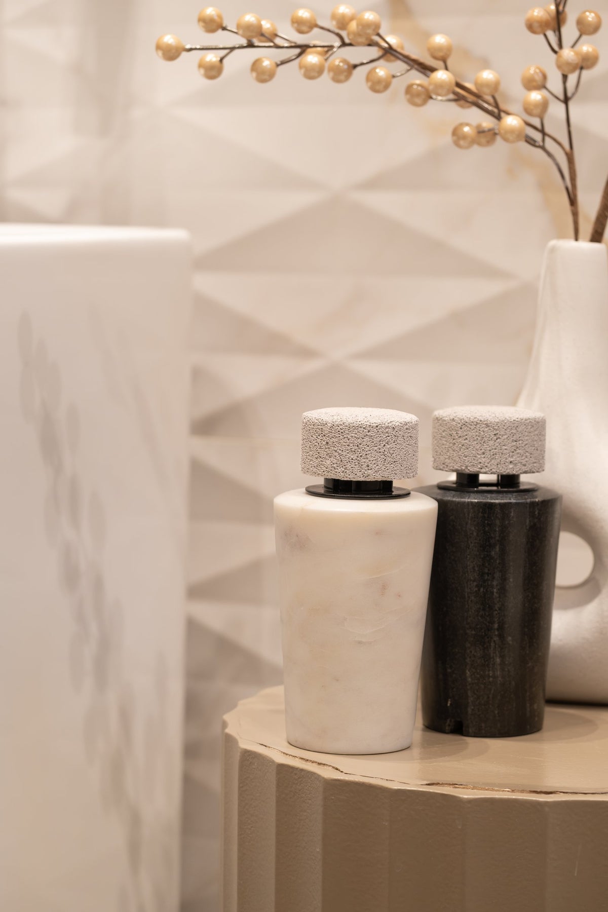 White and dark marble diffusers side by side